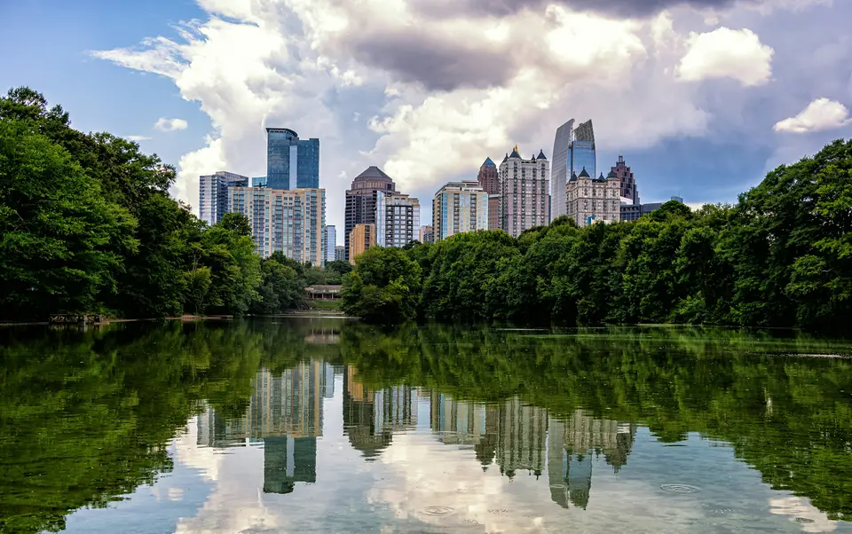 a body of water with a city in the background — Atlanta