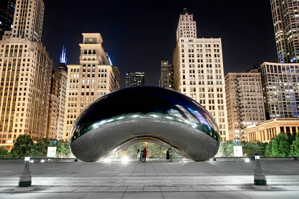 people walking on street near high rise buildings during night time — Chicago