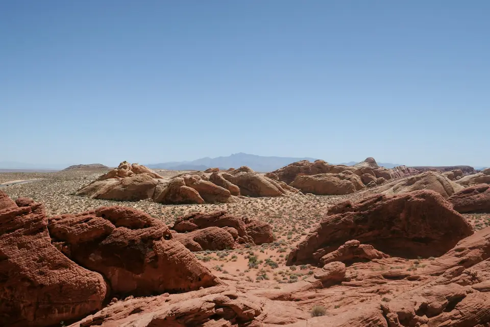 a desert landscape with rocks and mountains in the background — Las Vegas