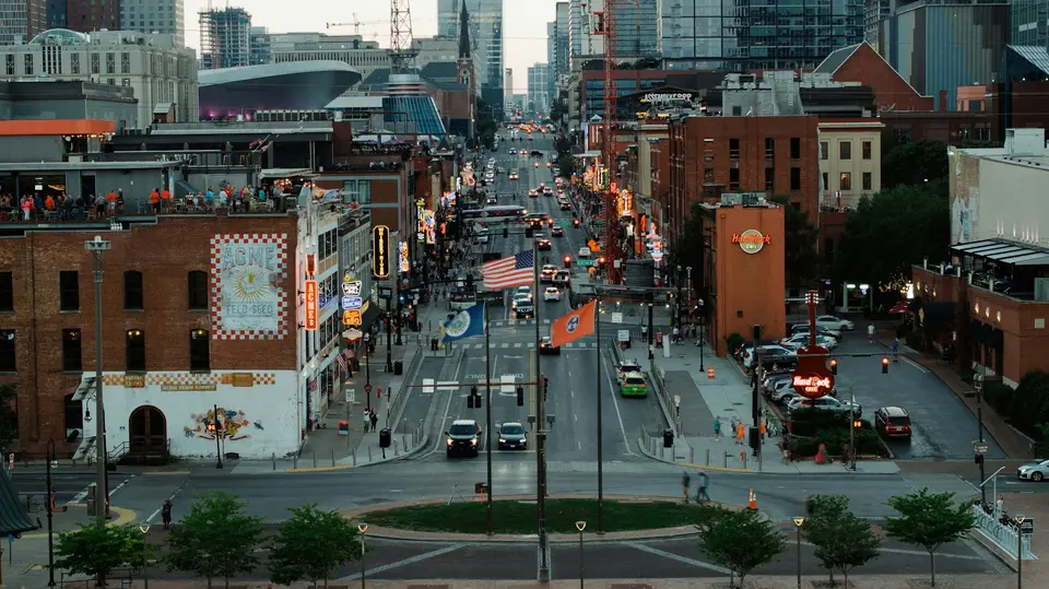 a city street filled with lots of traffic and tall buildings — Nashville
