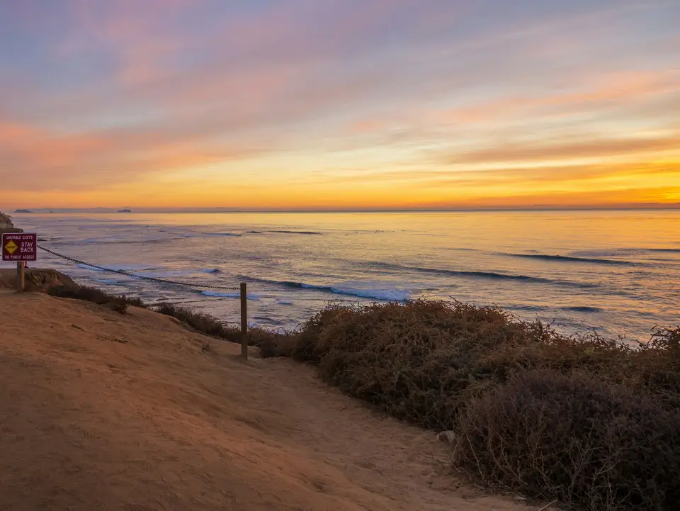 calm sea under dramatic clouds during sunset — San Diego