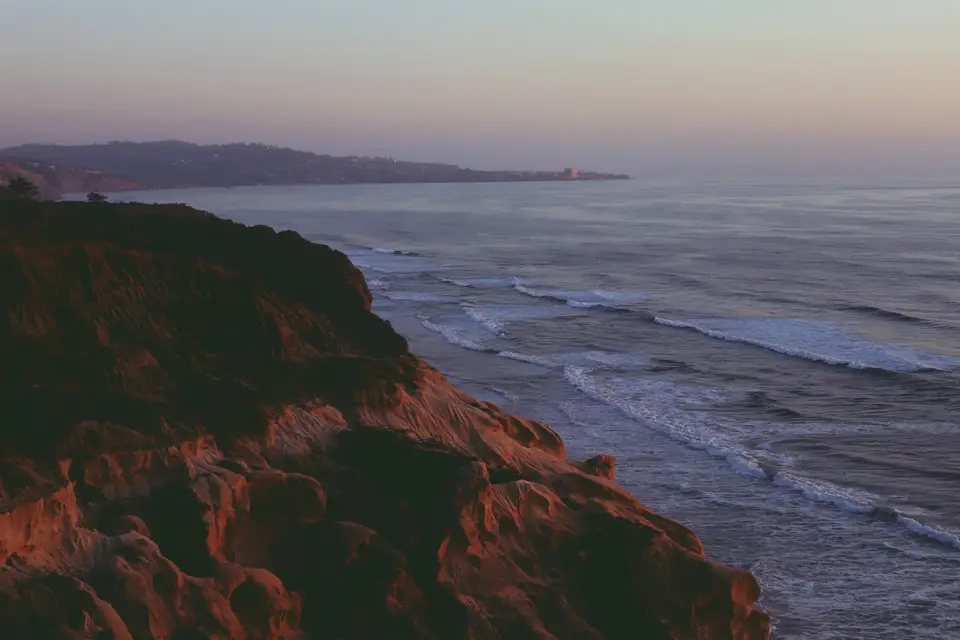 Cliffside view of the ocean during a sunset — San Diego